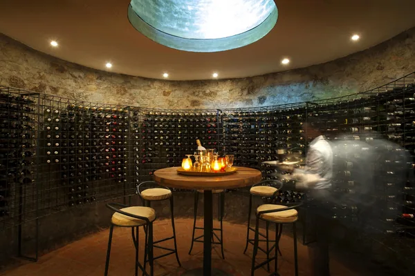 Round stone wine cellar with tasting table